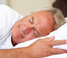 Man sleeping soundly in bed