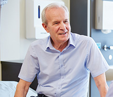 Smiling older man in dental chair