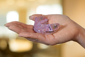 Hand holding an oral appliance