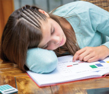 Teen girl falling asleep in class
