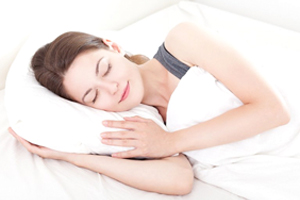 woman sleeping peacefully on pillow