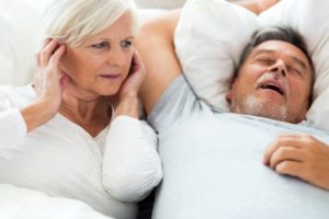 woman angry at husband snoring