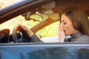 woman struggling to stay awake in care