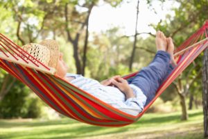 Man with sleep apnea in Columbus sleeping in a hammock